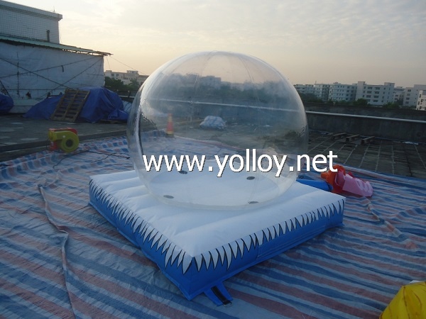 Inflatable snow globe with air bouncy mat