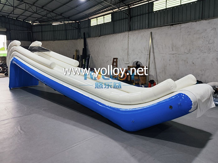 Inflatable dock slide into water