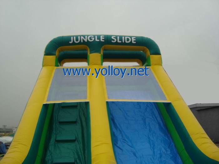 Green inflatable jungle slide for business rentals