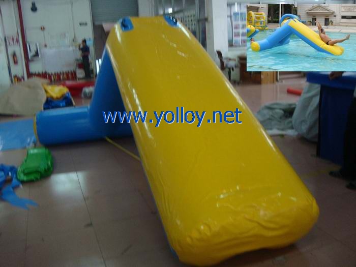 Inflatable water slide floating on water