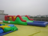 Floating water slide obstacle course