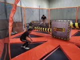 Trampoline park spinning wipe out bar