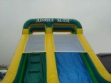 Green inflatable jungle slide for business rentals