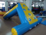 Inflatable water slide floating on water