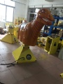 Mechanical dinosaur rodeo for inflatable game